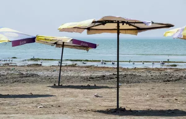 A picture shows empty tourist facilities by Lake Habbaniyah affected by severe drought in Iraq's Anbar province, on August 11. [Murtadha Ridha/AFP]