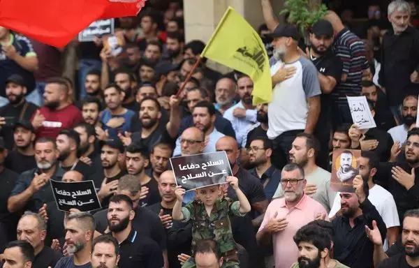 People attend the funeral of a Hizbullah fighter in Beirut's southern suburb on August 10. [Anwar Amro/AFP]