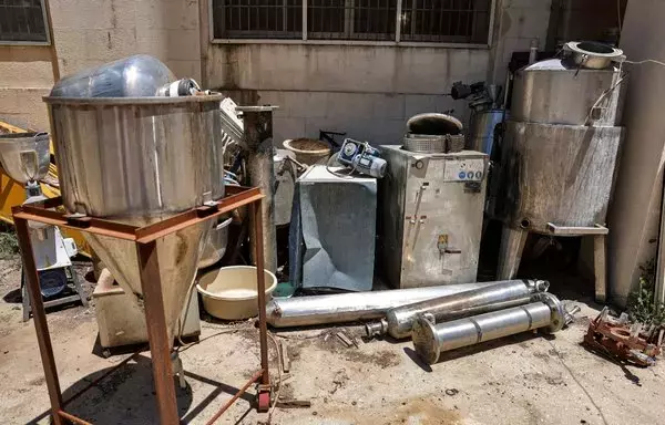 This picture taken July 21, 2022, shows a view of confiscated Captagon pill manufacturing instruments presented at the judicial police headquarters in the city of Zahle in Lebanon's Bekaa Valley. [Joseph Eid/AFP]