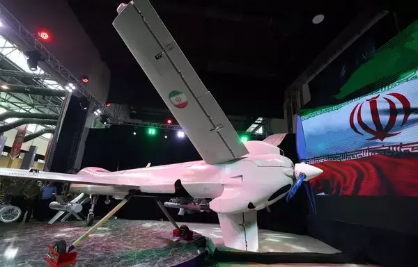 A picture shows the new Iranian Mohajer-10 drone during Iran's defense industry achievements exhibition in Tehran on August 23. [Atta Kenare/AFP]