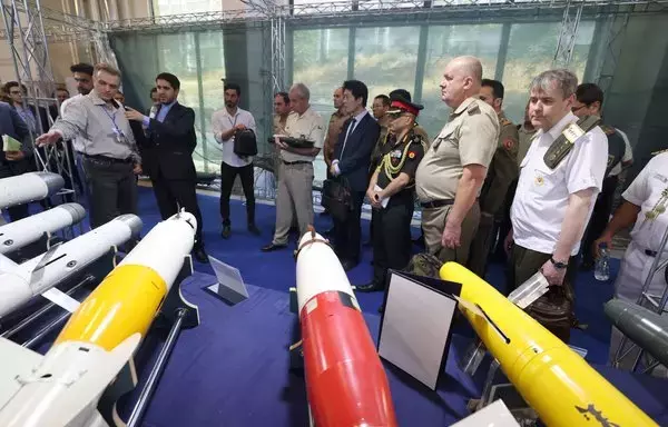 Foreign military advisors visit Iran's defense industry achievements exhibition in Tehran on August 23. [Atta Kenare/AFP]
