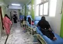 
Yemeni women suffering from cancer sit on makeshift beds in the corridor of the National Oncology Centre in Taez city, on April 29, 2021. [Ahmad al-Basha/AFP]        