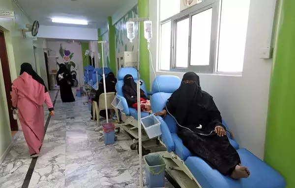 Yemeni women suffering from cancer sit on makeshift beds in the corridor of the National Oncology Centre in Taez city, on April 29, 2021. [Ahmad al-Basha/AFP]