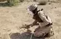 
A member of Yemen's pro-government forces prepares a mine for remote detonation in the village of Hays in Yemen's western province of al-Hodeidah on August 11. [Khaled Ziad/AFP]        