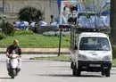 
A poster with portraits of Syrian president Bashar al-Assad and Hizbullah chief Hassan Nasrallah is seen in the coastal city of Latakia, the heartland of the Syrian president's Alawite sect, on March 17, 2016. More recently, anti-regime sentiment has been on the rise in the area, local activists say. [Louai Beshara/AFP]        