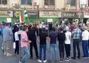 
People take part in an anti-regime protest in the southern city of Sweida on September 5. [Sam Hariri/AFP]        