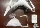 
Jordanian security forces display a drone, with a bag of crystal meth it was carrying, that they shot down as it crossed into the kingdom from Syria on June 13. [Jordan Armed Forces - Arab Army]        