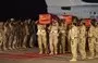 
Members of the Bahraini armed forces on September 5, 2015, carry the coffins of comrades killed during the battle against the Houthis during an official repatriation ceremony at Isa air base in Sakhir, south of Manama. [Mohammed al-Shaikh/AFP]        