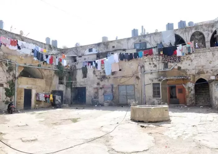 Old houses in the poverty-stricken northern city of Tripoli are in need of repair and restoration after years of neglect. [Naji Akram/Al-Fassel]