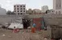 
A family in Sanaa's Bayt Baws district has been residing in this makeshift shelter on an unpaved street. [Yazan Abdul Aziz/Al-Fassel]        