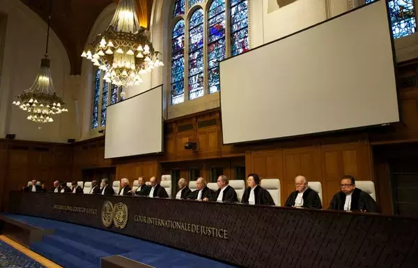 Judges of the International Court of Justice sit in court on November 22, 2013 in The Hague before delivering a judgement. [Nicolas Delaunay/AFP]