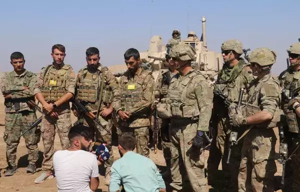 Syrian Democratic Forces and international coalition forces are seen in a photograph posted online on September 7, 2022, as they participate in a joint training to enhance capabilities in the fight against ISIS. [SDF]