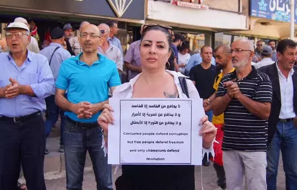 Syrian female activists protest in the southern city of Sweida on September 5. The protests in Sweida began after the Syrian regime ended fuel subsidies in August. [Sam Hariri/AFP]