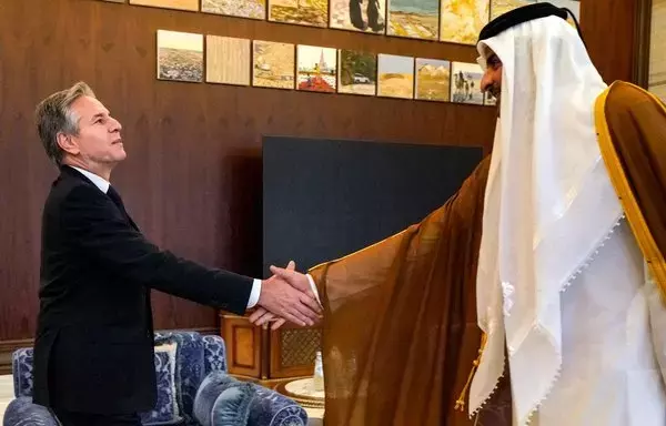 US Secretary of State Antony Blinken shakes hands with Qatar's Emir Sheikh Tamim bin Hamad al-Thani during their meeting in Lusail on October 13. Qatar is playing a key role as a mediator in the international effort to release hostages held by Hamas. [Jacquelyn Martin/Pool/AFP]