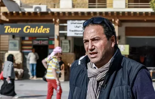 Chief Commissioner for Jordan's Petra Development and Tourism Region Authority Suleiman Farajat stands outside the Petra Museum at the ancient Nabatean site last December 12. The kingdom saw a post-pandemic tourism revival in 2022, but the Hamas-Israel war is now threatening the industry once again. [Khalil Mazraawi/AFP]