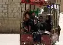 
Children are transported in the back of a small truck in the northern Yemen province of Amran on July 6, 2019. Amran, a strategic gateway to Sanaa, was taken by the Iran-backed Houthis on July 8, 2014. [Mohammed Huwais/AFP]        