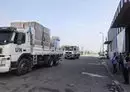 
UN aid is loaded on trucks to be distributed to Palestinian families in the central Gaza city of Deir al-Balah on October 28, amid the ongoing battles between Israel and the Palestinian militant group Hamas. [Mohammed Abed/AFP]        