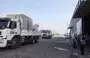 
UN aid is loaded on trucks to be distributed to Palestinian families in the central Gaza city of Deir al-Balah on October 28, amid the ongoing battles between Israel and the Palestinian militant group Hamas. [Mohammed Abed/AFP]        