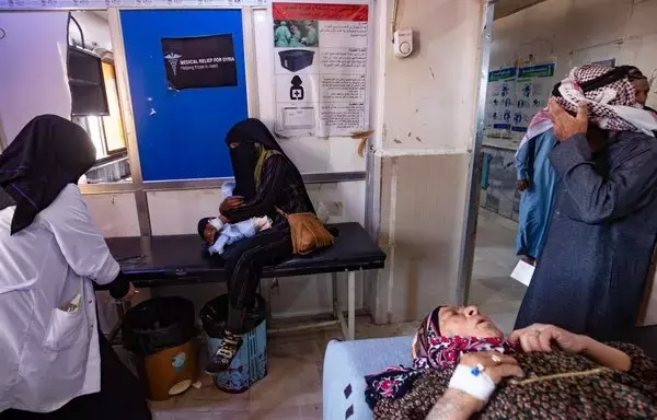 People suffering from cholera receive treatment at Al-Kasrah hospital in Deir Ezzor on September 17, 2022, affected by the usage of contaminated water from the Euphrates River. Nearly two thirds of water treatment plants, half of pumping stations and one third of water towers in Syria have been damaged by more than a decade of war, according to the United Nations. [Delil Souleiman/AFP]