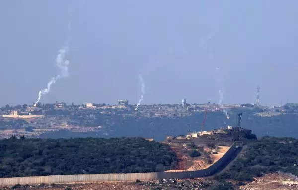 Flares are fired from northern Israel over the southern Lebanese border village of Aita al-Shaab on October 28. Nearly 29,000 people have been displaced in Lebanon amid deadly exchanges between Iran-backed Hizbullah and the Israeli army, a United Nations agency said on October 27. [Fadel Senna/AFP]