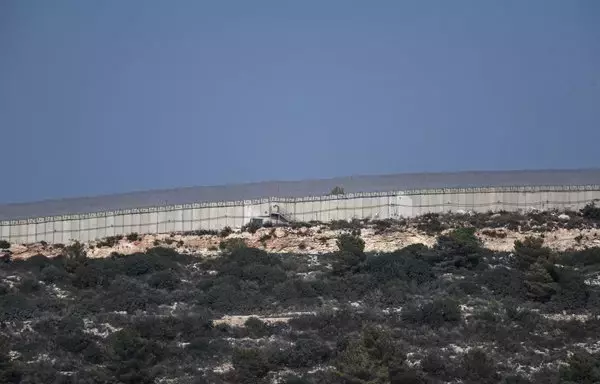 A picture take October 23 shows the border wall separating northern Israel from southern Lebanon. [Yuri Cortez/AFP]