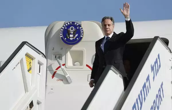 US Secretary of State Antony Blinken waves as he disembarks from an aircraft for the start of his visit to Israel, amid the ongoing conflict between Israel and Hamas, at Ben Gurion International Airport near Tel Aviv on November 3. [Jonathan Ernst/AFP]