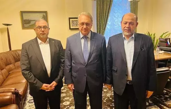 Russian Deputy Foreign Minister and Special Representative for the Middle East Mikhail Bogdanov (center) hosts a meeting with Hamas representative Moussa Abu Marzouk (right) in Moscow on October 26. [File]