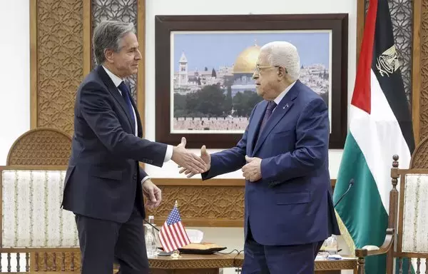 US Secretary of State Antony Blinken shakes hands with Palestinian president Mahmud Abbas in Ramallah on November 5. [Jonathan Ernst/Pool/AFP]