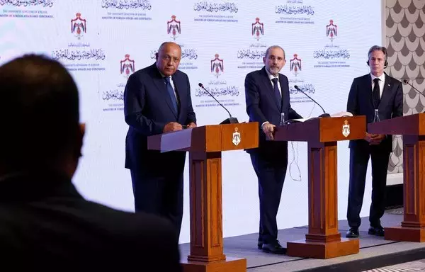 US Secretary of State Antony Blinken, Egyptian Foreign Minister Sameh Shoukry and Jordanian Deputy Prime Minister and Foreign Minister Ayman Safadi hold a press conference in Amman on November 4. [Jonathan Ernst/Pool/AFP]