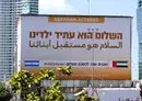 
A billboard by the United Arab Emirates Embassy marking the signing of the US-brokered Abraham Accords is seen along the expressway in the Israeli coastal city of Tel Aviv on September 14, 2021. [Jack Guez/AFP]        