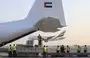 
An Emirates cargo plane is loaded with aid for Gaza at the airport in Dubai before flying to the city of al-Arish in Egypt’s North Sinai province on October 17. [Karim Sahib/AFP]        