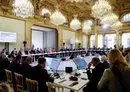 
French President Emmanuel Macron (C, gray suit) November 9 in Paris speaks next to representatives from countries, international organizations, businesses, development banks and NGOs during an international humanitarian conference for civilians in Gaza. [Ludovic Marin/Pool/AFP]        