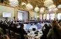 
French President Emmanuel Macron (C, gray suit) November 9 in Paris speaks next to representatives from countries, international organizations, businesses, development banks and NGOs during an international humanitarian conference for civilians in Gaza. [Ludovic Marin/Pool/AFP]        