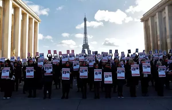 People take part in a rally in Paris to call for the release of the more than 200 hostages held by the Hamas terrorist group in Gaza, on November 7. [Geoffroy Van Der Hasselt/AFP]