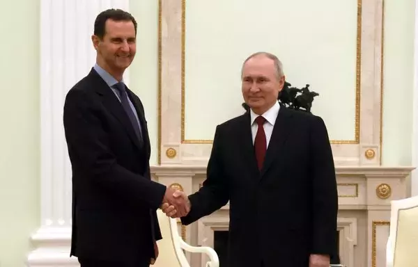 Russian President Vladimir Putin meets with his Syrian counterpart Bashar al-Assad at the Kremlin in Moscow on March 15. Both are facing international arrest warrants for war crimes.[Vladimir Gerdo/SPUTNIK/AFP]