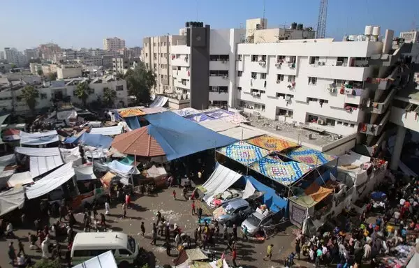 An aerial view shows the compound of Al-Shifa Hospital in Gaza City on November 7, amid the ongoing battles between Israel and Hamas. [Bashar Taleb/AFP]