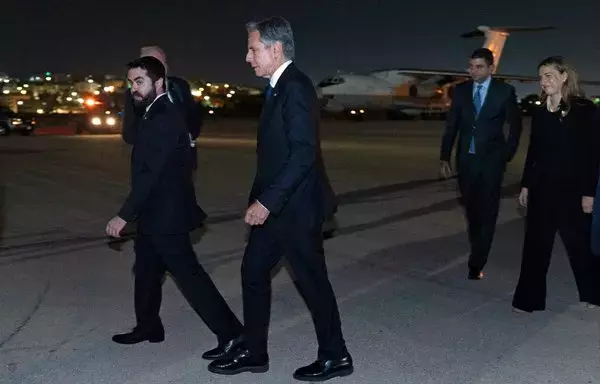 US Secretary of State Antony Blinken arrives in Amman, Jordan, on October 12. [Jacquelyn Martin/POOL/AFP]