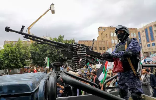 A member of Houthi-affiliated security forces mans a gun during a November 18 rally in Sanaa, amid ongoing battles between Israel and Hamas. [Mohammed Huwais/AFP]