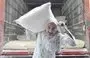 
A worker at a flour warehouse in Beirut supplies a bakery with bags of flour before the stock dwindles. [Ziyad Hatem/Al- Fassel]        