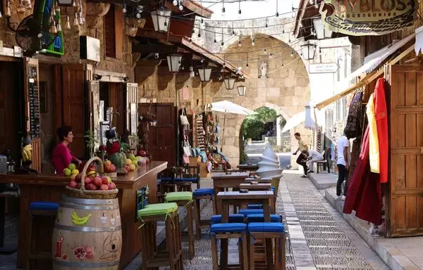 Empty tables await diners at a restaurant in Lebanon's Byblos on November 10, as fears of a spillover of violence from the Israel-Hamas war keep tourists away. [Joseph Eid/AFP]