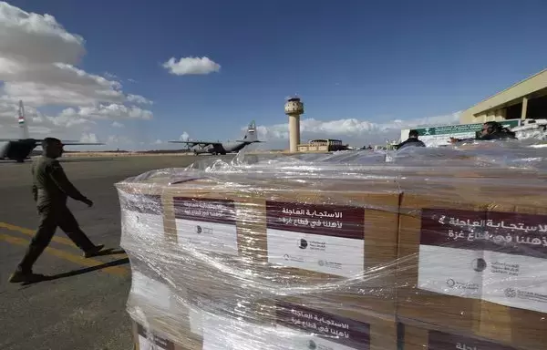 Aid for Gaza is unloaded on the tarmac of Egypt's al-Arish airport on November 27, as the truce between Israel and Hamas entered its final 24 hours. [Khaled Desouki/AFP]