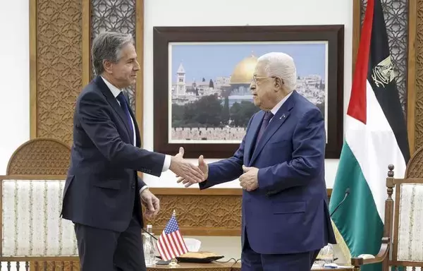 US Secretary of State Antony Blinken shakes hands with Palestinian president Mahmud Abbas in the West Bank city of Ramallah on November 5. Blinken is set to return to Ramallah this week. [Jonathan Ernst/Pool/AFP]