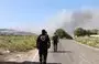 
Lebanese civil defense volunteers walk towards a forest fire that reportedly ignited after shelling from Israel in Alma al-Shaab, close to south Lebanon's border with Israel on October 26, amid the ongoing battles between Israel and Hamas in the Gaza strip. [AFP]        