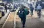 
Palestinians carry some belongings as they move to safer areas following the resumption of Israeli strikes on Rafah in the southern Gaza strip on December 1, after the expiration of a seven-day truce between Israel and Hamas. [Mahmud Hams/AFP]        