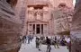 
Visitors tour near the Treasury at the ruins of the ancient Nabatean city of Petra in southern Jordan on December 12, 2022. Petra drew 900,000 visitors last year, close to the previous record of one million set in 2019. Now, the Israel-Hamas war threatens to undo those gains. [Khalil Mazraawi/AFP]        