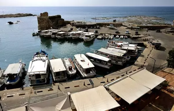 A picture shows docked tour boats at the port of Lebanon's historical city of Byblos, on November 10. Four years into an economic meltdown, Lebanon's restaurants, cafes, hotels and shops now face yet another challenge: keeping afloat during the Israel-Hamas war and related hostilities on the Lebanon-Israel border. [Joseph Eid/AFP]