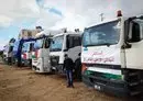 
An aid convoy transporting a Jordanian field hospital is seen parked upon arrival in Khan Yunis in the southern Gaza strip on November 20, after passing through the Rafah border crossing with Egypt amid continuing battles between Israel and Hamas. [Mahmud Hams/AFP]        