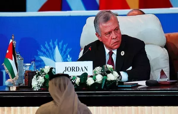 Seen on a large screen, Jordan's King Abdullah II attends the International Peace Summit hosted by Egypt in the New Administrative Capital on October 21, amid the ongoing battles between Israel and Hamas. [Khaled Desouki/AFP]