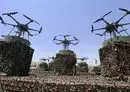 
Drones are displayed on the back of a vehicle during a Houthi military parade in Sanaa, on September 21. [Mohammed Huwais/AFP]        