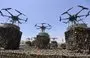 
Drones are displayed on the back of a vehicle during a Houthi military parade in Sanaa, on September 21. [Mohammed Huwais/AFP]        